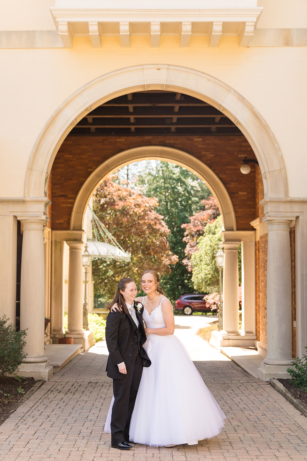 Katie + Rachel under the porte cochere.