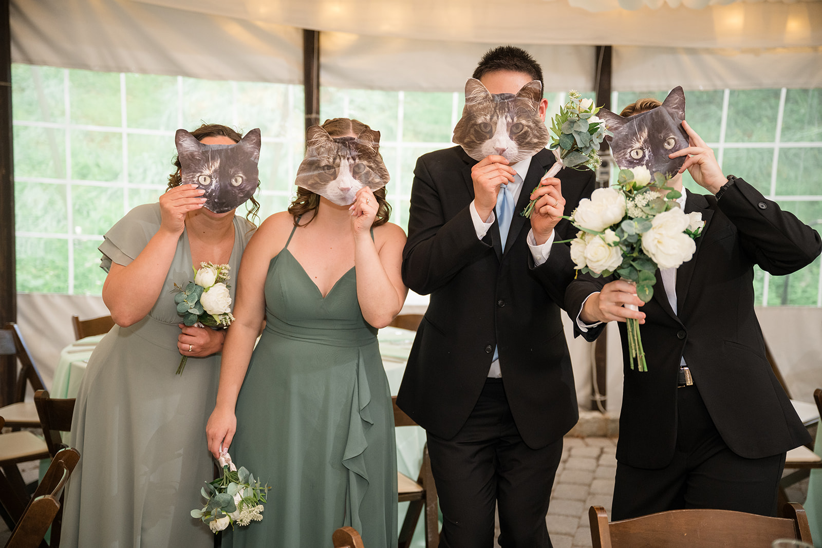 Katie + Rachel's bridal party with cat masks on.