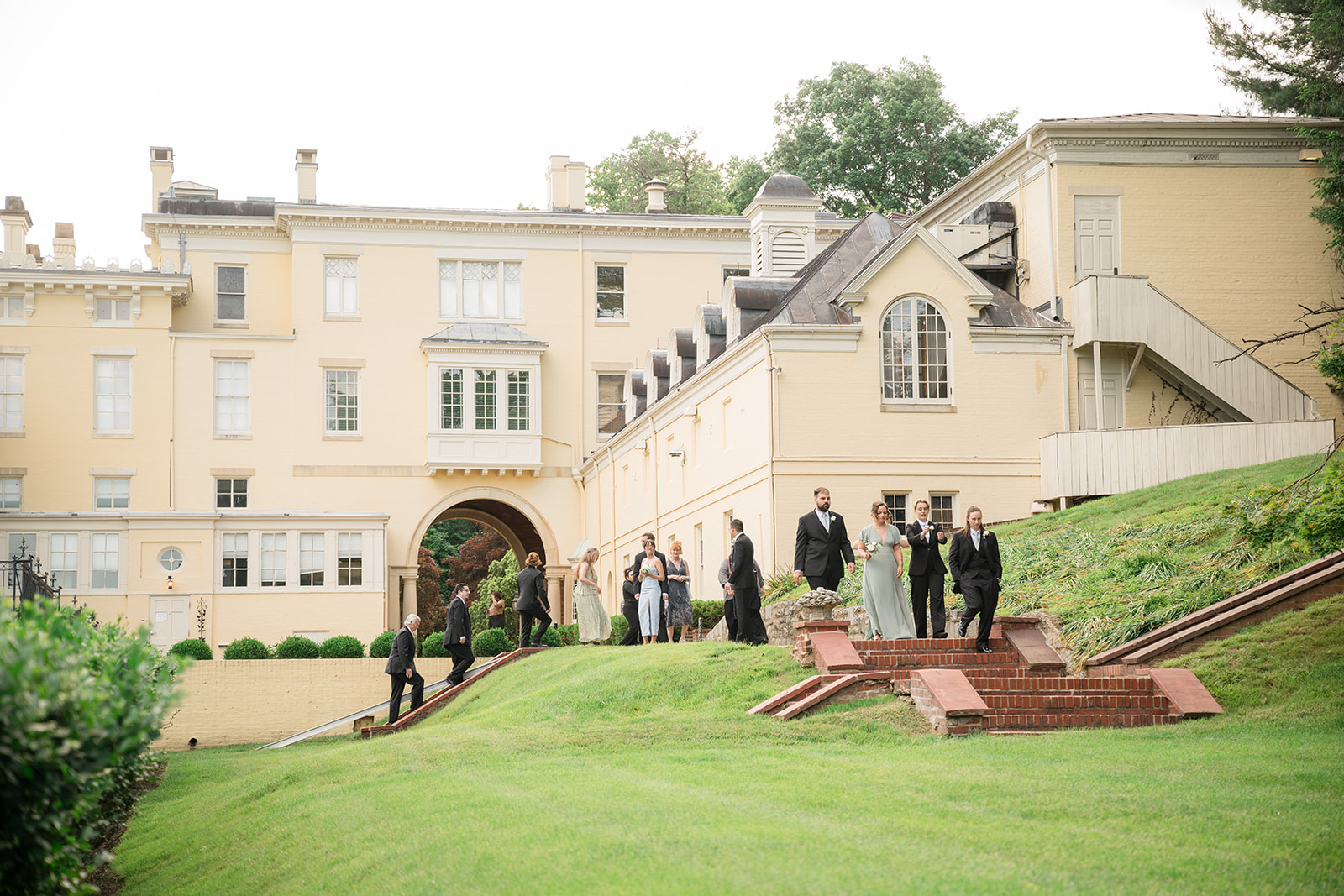 Katie + Rachel's bridal party heading down the steps.