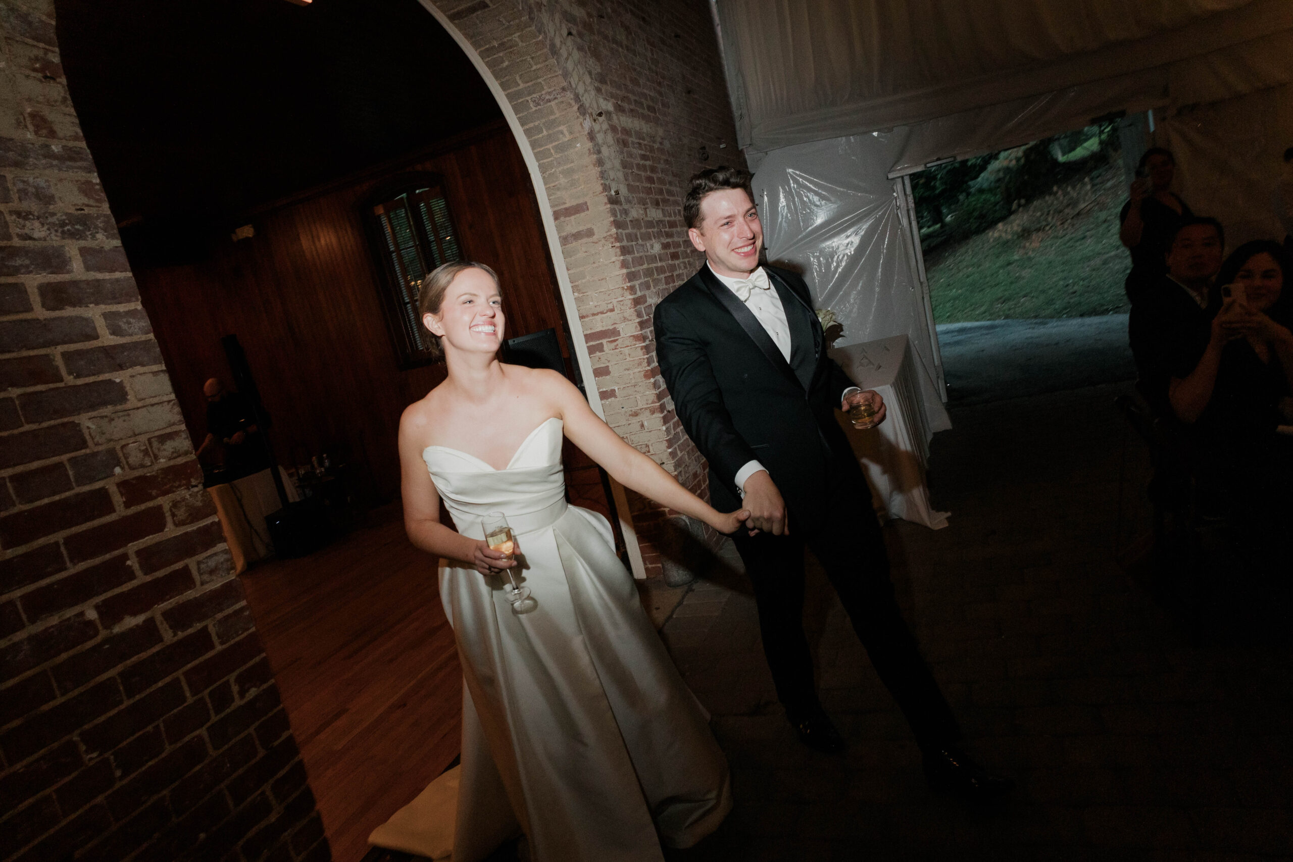 Caroline and Colin entering their reception.