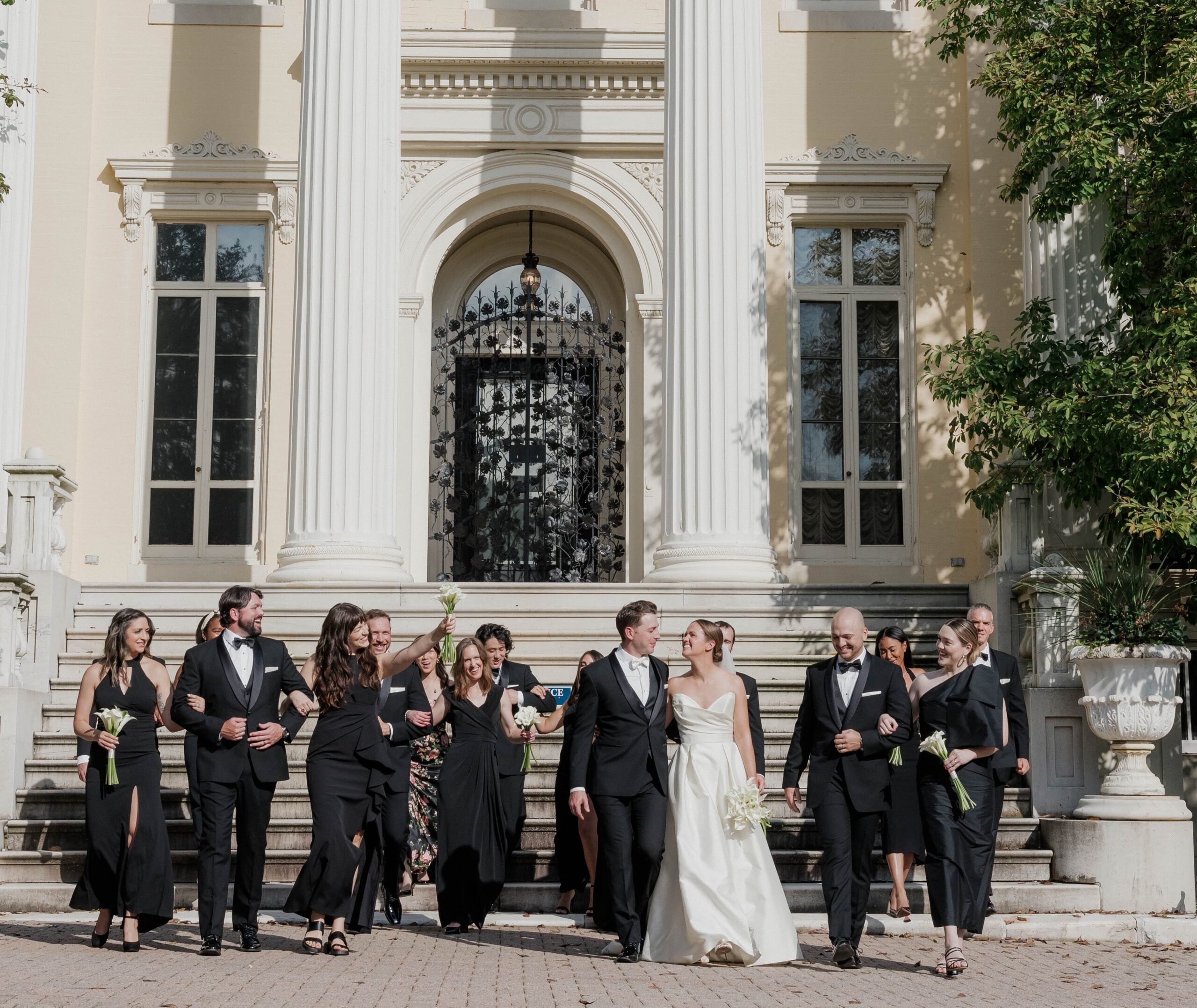Caroline and Colin's bridal part on the steps of the mansion.